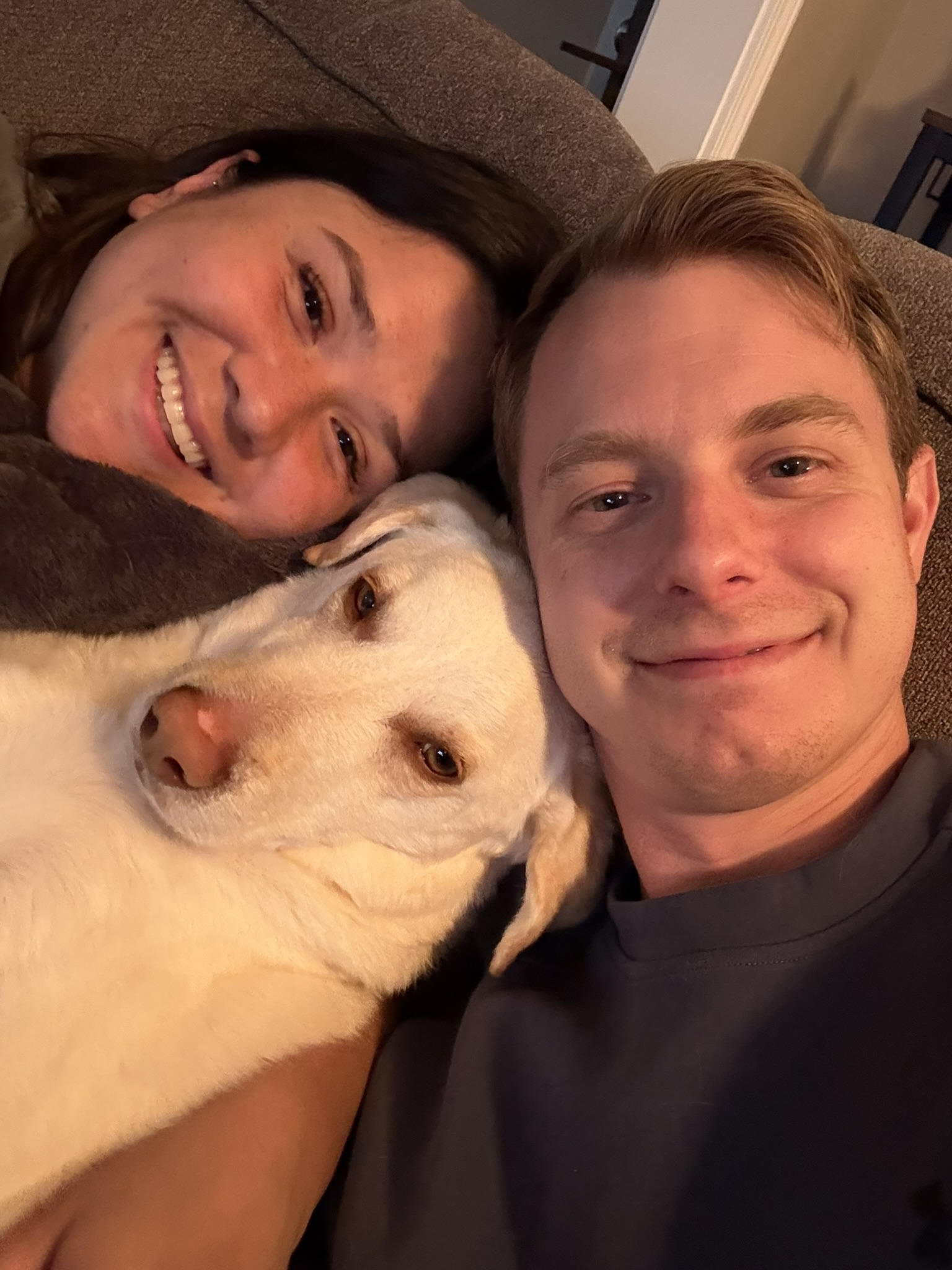 Aaron and Hannah at home with their dog Owen